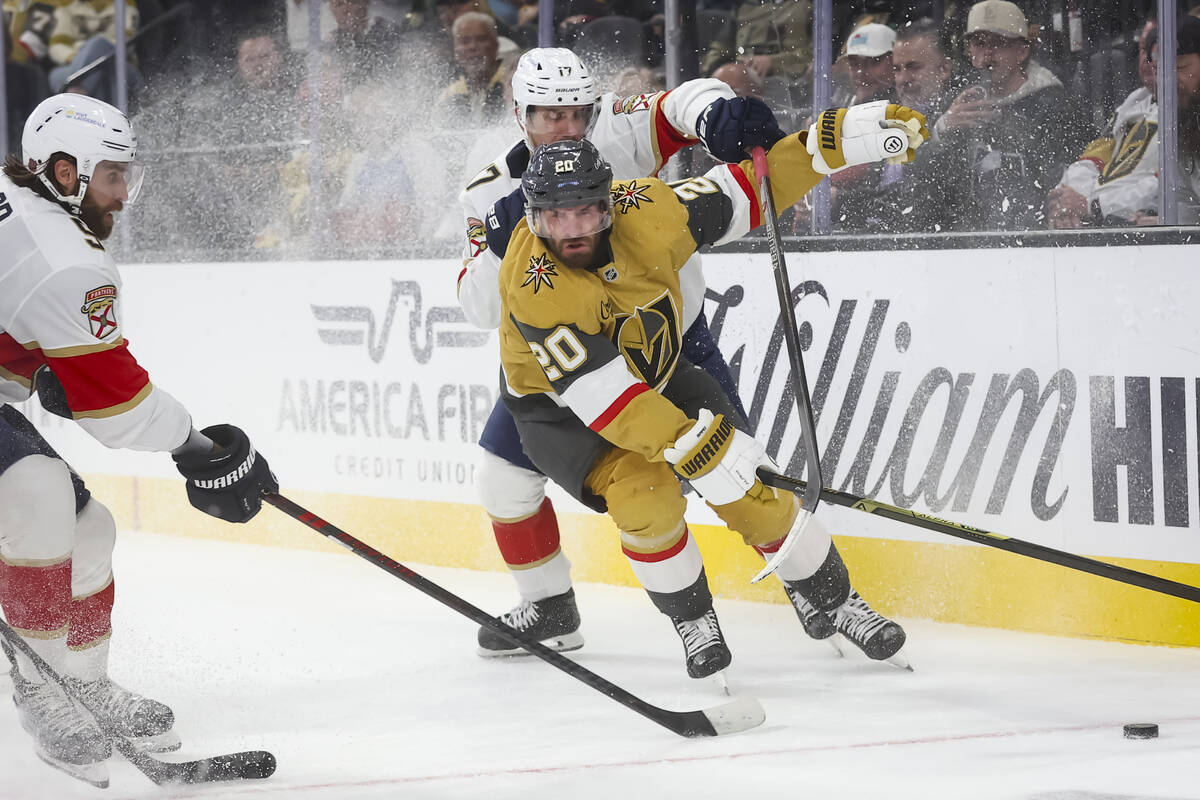 Golden Knights left wing Brandon Saad (20) and Florida Panthers center Evan Rodrigues (17) vie ...