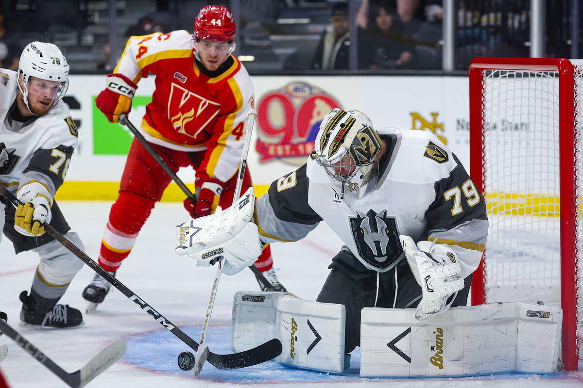 Silver Knights goaltender Carter Hart (79) defends the net during the second period of an AHL h ...