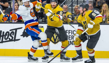 Golden Knights defenseman Jeremy Lauzon (5) checks New York Islanders defenseman Adam Pelech (3 ...