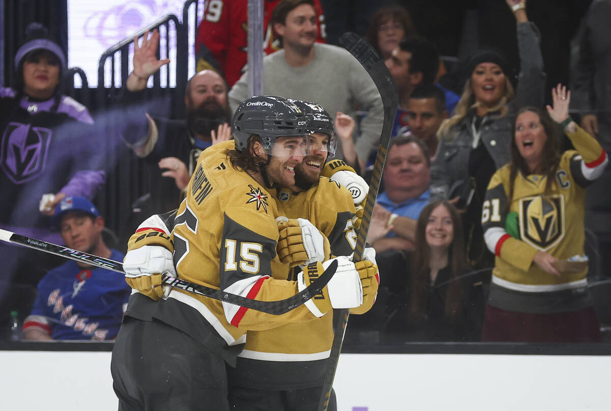 Golden Knights defenseman Noah Hanifin (15) celebrates his goal with defenseman Shea Theodore ( ...