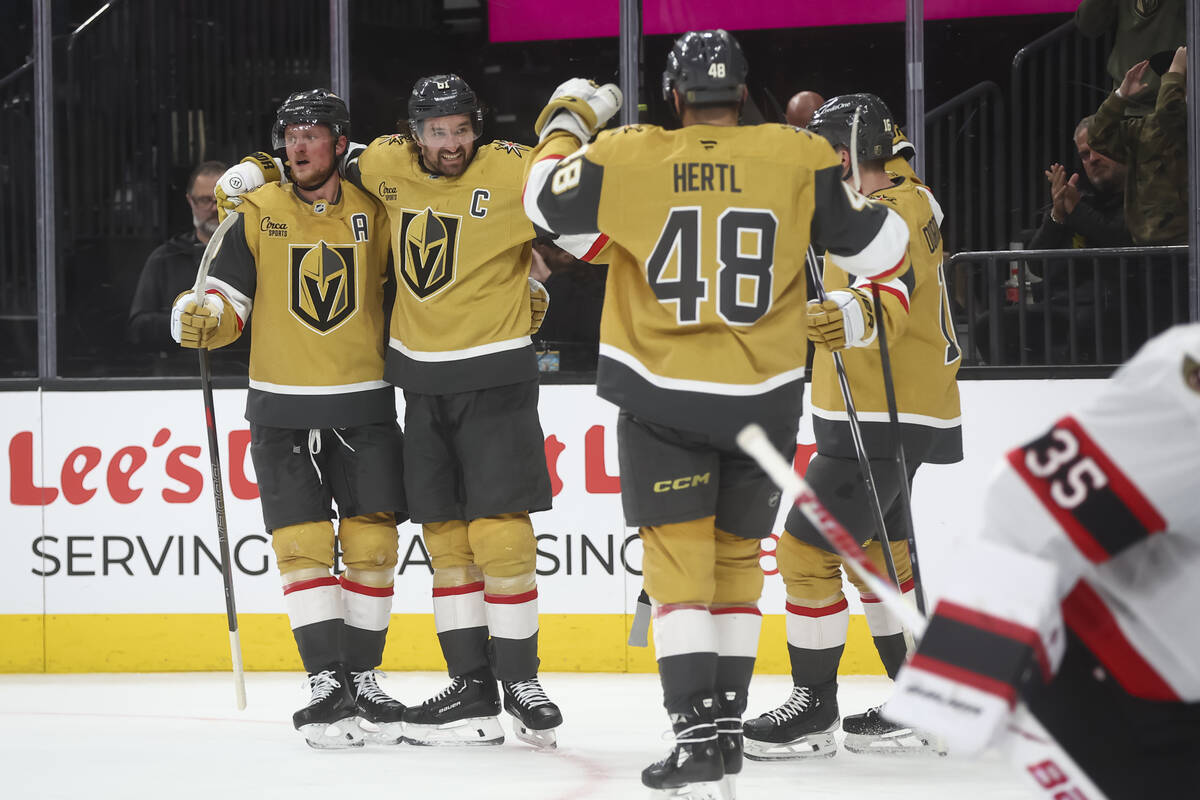 Golden Knights right wing Mark Stone, second from left, celebrates his goal with teammates duri ...