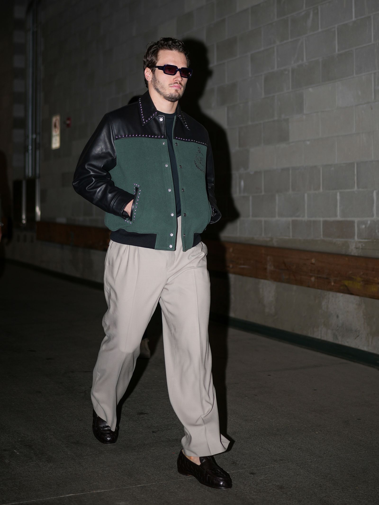 Sergachev rocking a sick studded varsity jacket before a game against the Minnesota Wild.