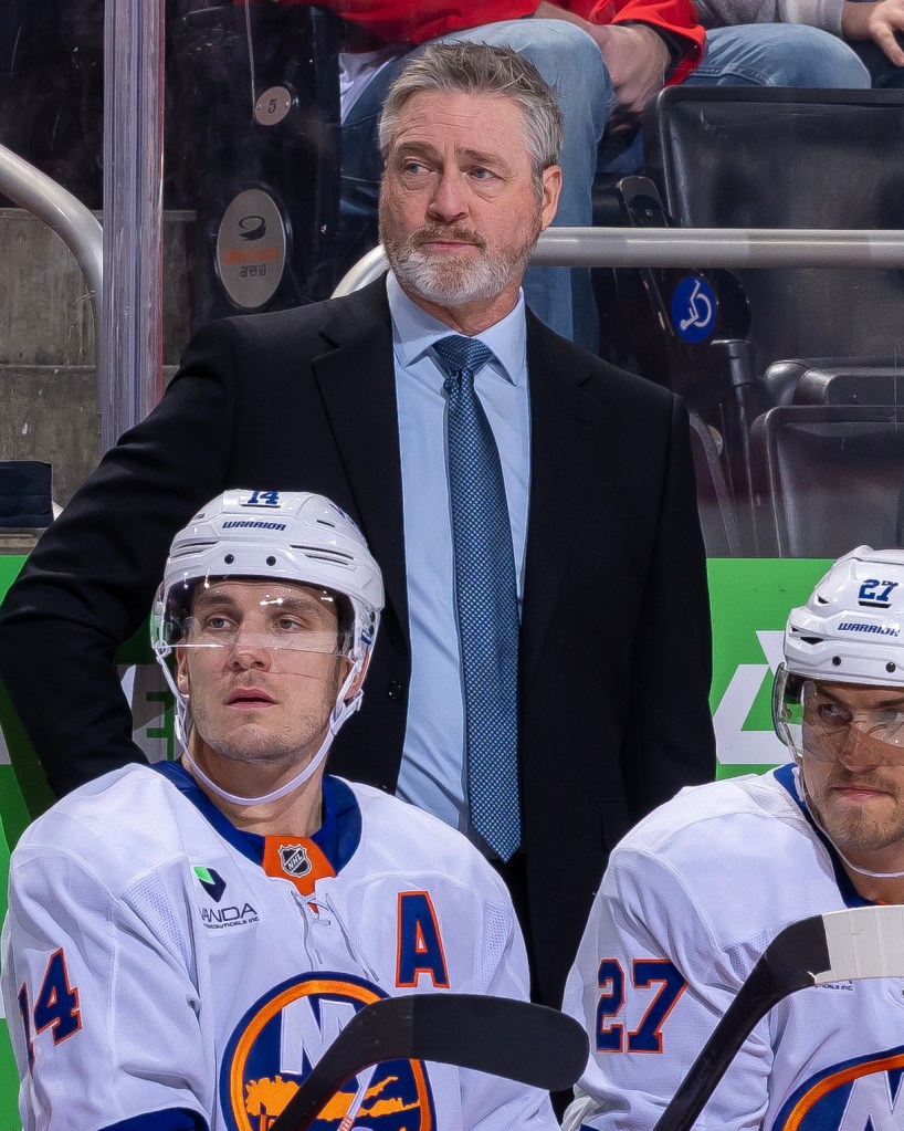 Head coach Patrick Roy of the New York Islanders watches the action from the bench against the Detroit Red Wings during the second period at Little Caesars Arena on November 20, 2025 in Detroit, Michigan. 