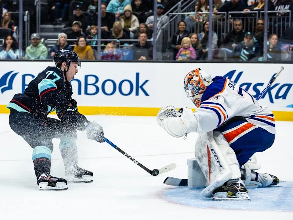  Edmonton Oilers goaltender Stuart Skinner, right, makes a save against a shot by Seattle Kraken centre Berkly Catton, left, during the second period of an NHL hockey game Saturday, Nov. 29, 2025, in Seattle.