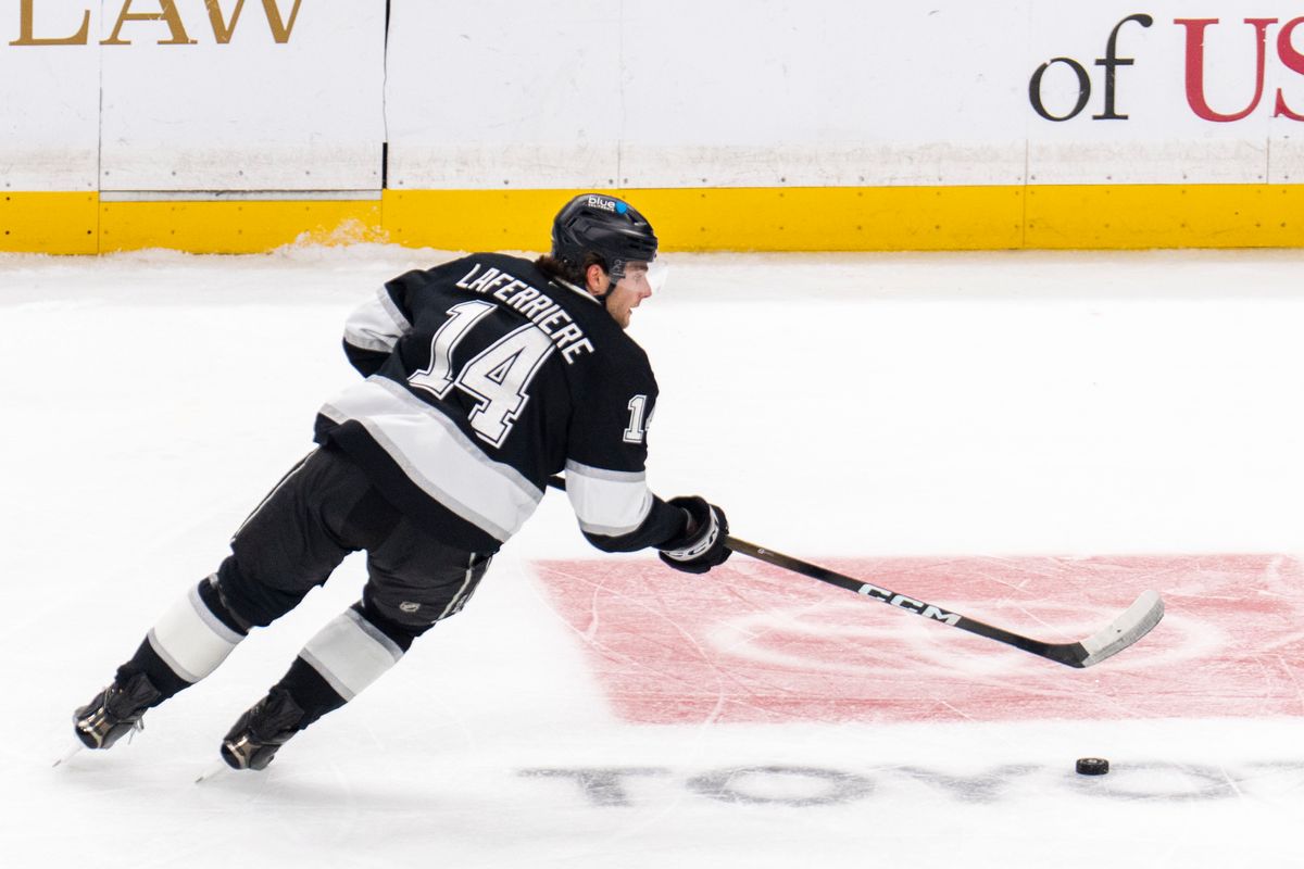 Los Angeles Kings RW Alex Laferriere (14) steals the puck during an NHL game against the Detroit Red Wings, Wednesday October 30th, 2025 in Los Angeles, California. 