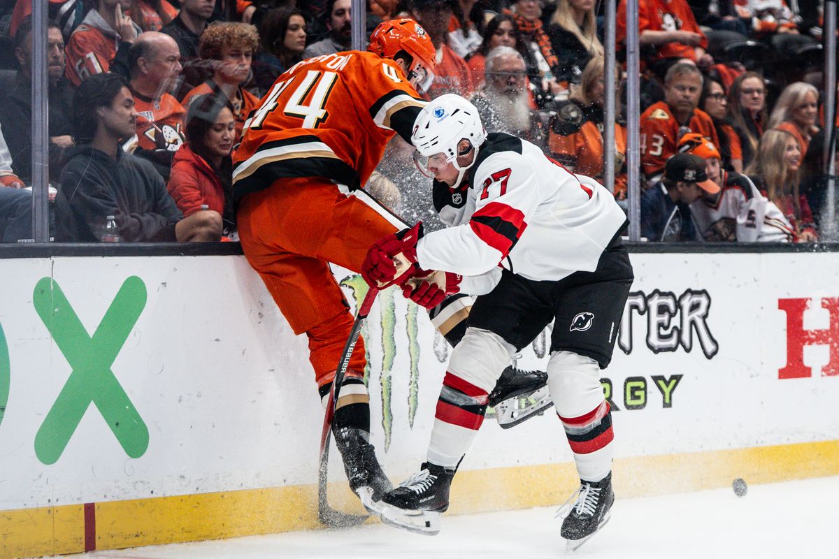 Anaheim Ducks LW Ross Johnston (44) gets launched into the glass during an NHL game against the New Jersey Devils on Sunday November 2, 2025 in Anaheim, California.