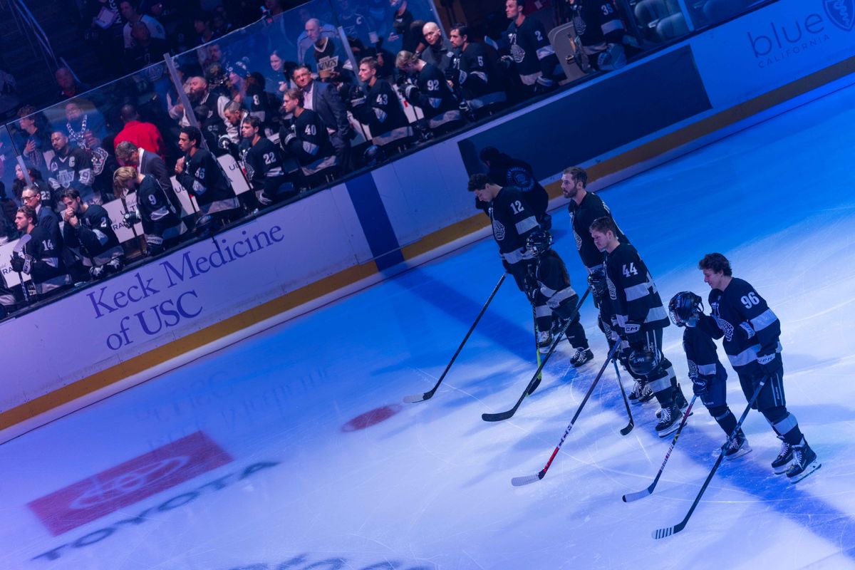 Los Angeles Kings players stand during the National Anthem before an NHL game between the Vancouver Canucks and the Los Angeles Kings, Saturday November 29, 2025 at Crypto.com Arena in Los Angeles, Calif.