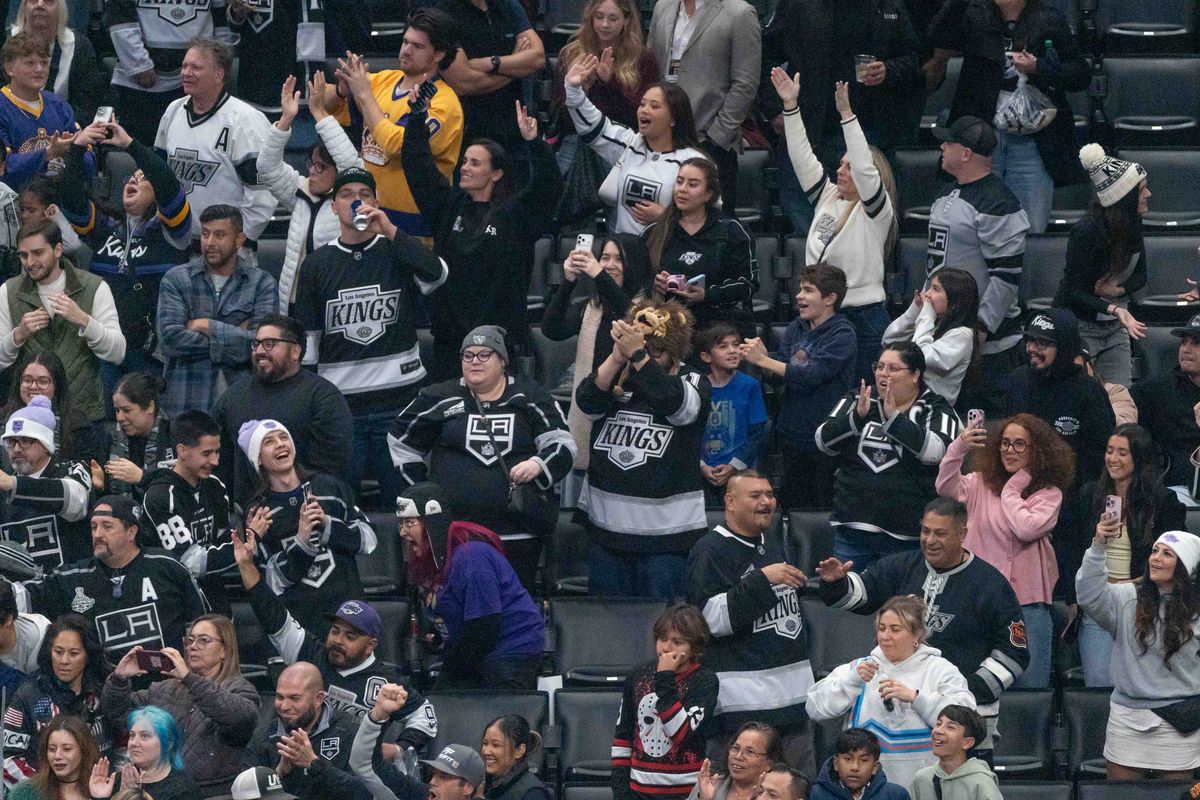 Kings fans celebrate a win during an NHL game between the Vancouver Canucks and the Los Angeles Kings, Saturday November 29, 2025 at Crypto.com Arena in Los Angeles, Calif.