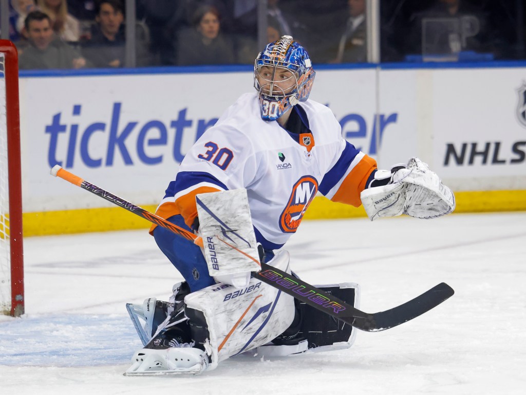 Ilya Sorokin #30 of the New York Islanders defends the net.