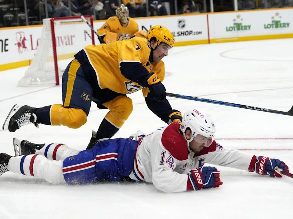  Predators defenceman Marc Del Gaizo collides with Canadiens captain Nick Suzuki during the third period in Nashville on April 6.