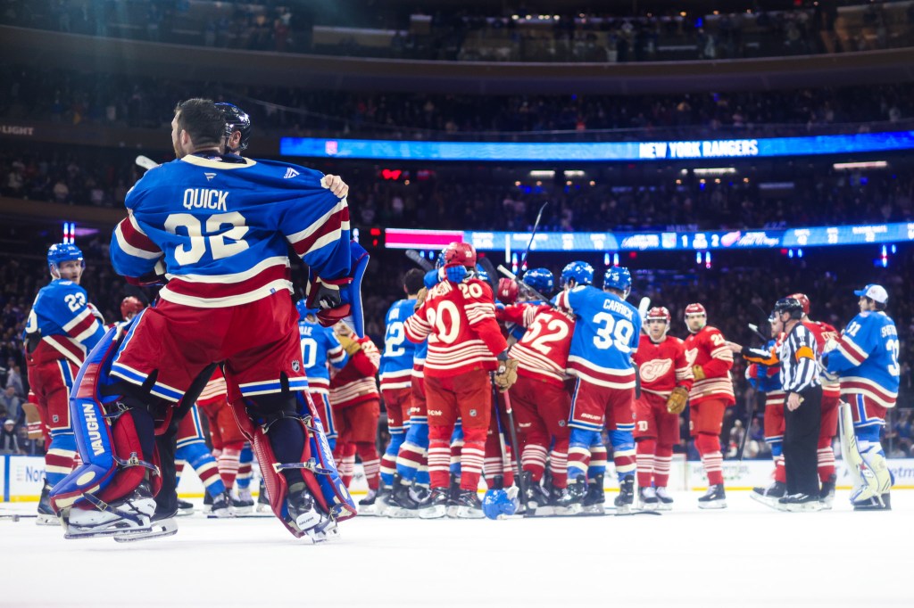 Jonathan Quick of the New York Rangers argues with Detroit Red Wings players as benches clear.