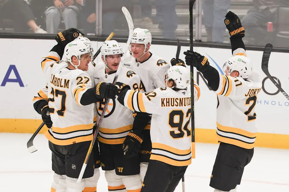 The Boston Bruins celebrate after scoring in overtime to win an NHL hockey game against the Los Angeles Kings, Friday November 21, 2025 in Los Angeles, Calif.