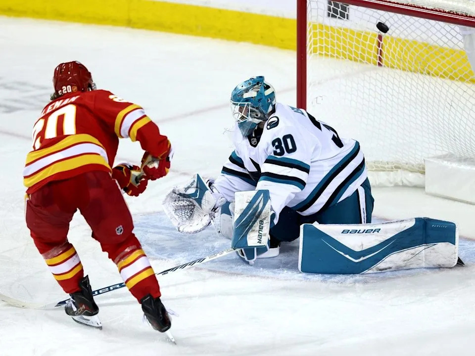  Flames forward Blake Coleman scores on Sharks goalie Yaroslav Askarov during Thursday’s game.