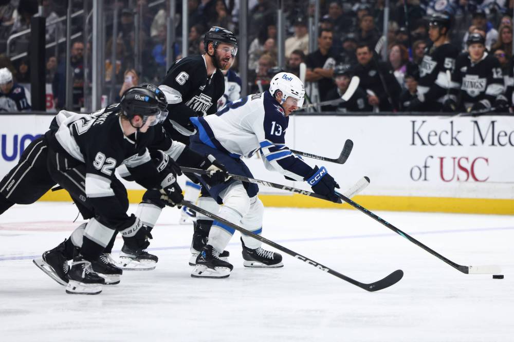Jessie Alcheh / THE ASSOCIATED PRESS FILES
Winnipeg Jets’ Gabriel Vilardi (13) battles for the puck against Los Angeles Kings during this season’s six-game road trip. Vilardi recalled his reunion with former Kings teammate Blake Lizotte two seasons ago that ended with the Jets centre missing six weeks because of an MCL sprain.