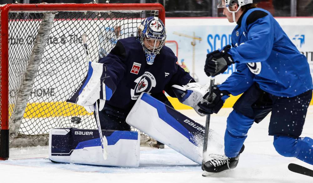 John Woods / THE CANADIAN PRESS FILES
It appears the Winnipeg Jets plan to start goaltender Thomas Milic (left) in Friday’s matinee game against the Carolina Hurricanes and give Eric Comrie the back end of the back-to-back against the Nashville Predators on Saturday.