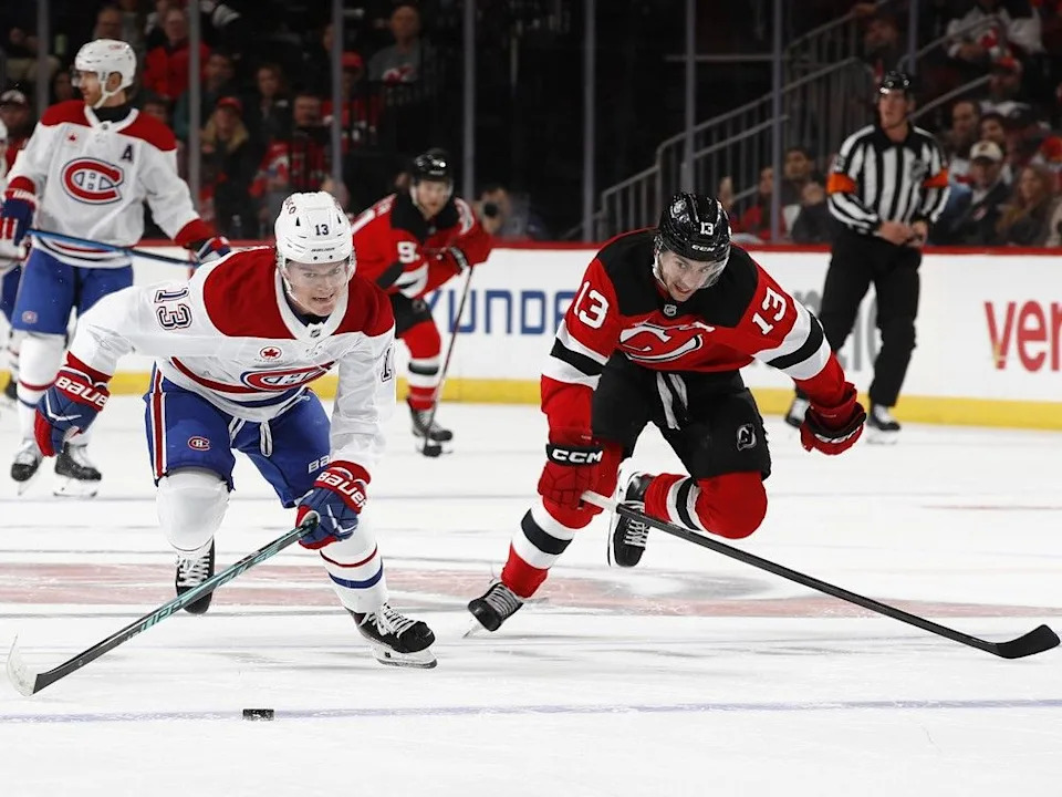  Canadiens’ Cole Caufield (13) competes for the puck against New Jersey Devils’ Nico Hischier (13) at Prudential Center on Thursday, Nov. 6, 2025, in Newark, N.J.