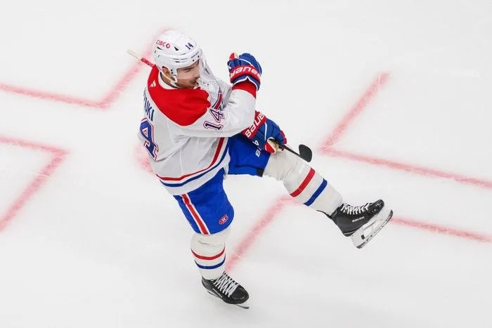  Montreal Canadiens centre Nick Suzuki celebrates scoring a goal during the third period of an NHL game against the Utah Mammoth, Wednesday, Nov. 26, 2025, in Salt Lake City.