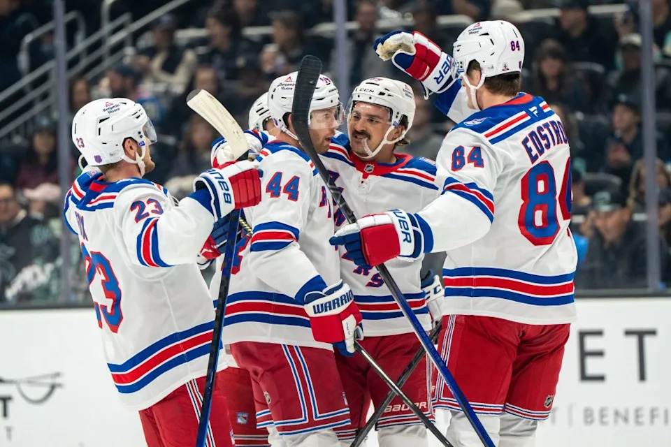 New York Rangers defenseman Vladislav Gavrikov (44), forward Sam Carrick, second from right, defenseman Adam Fox (23) and forward Adam Edstrom (84) celebrate a goal during the first period of an NHL hockey game against the Seattle Kraken, Saturday, Nov. 1, 2025. AP