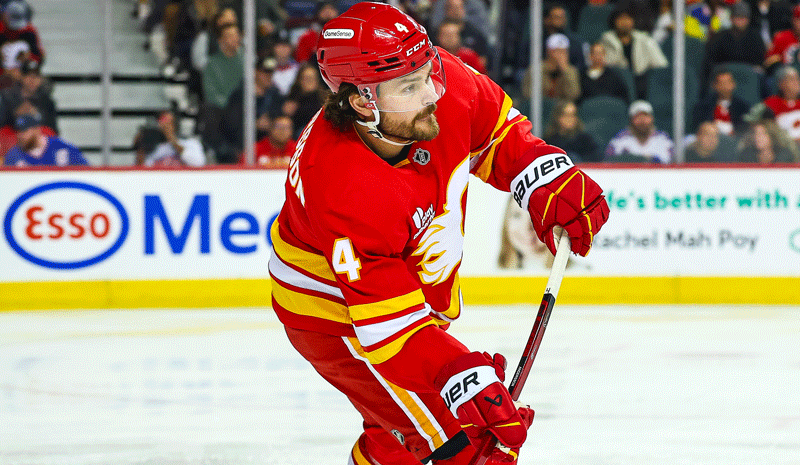 Calgary Flames defenseman Rasmus Andersson (4) shoots the puck against the New York Rangers during the first period at Scotiabank Saddledome.
