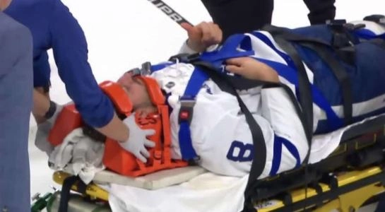 Toronto Maple Leafs defenseman Chris Tanev is stretchered off the ice against the Philadelphia Flyers