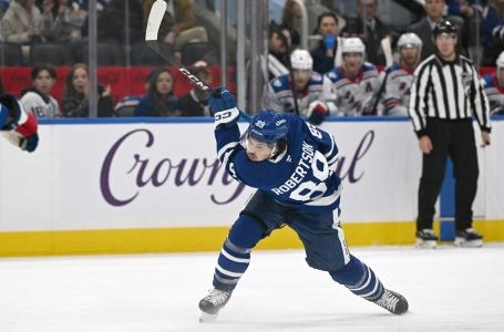Toronto Maple Leafs forward Nick Robertson follows through on a slapshot against the New York Rangers Toronto Maple Leafs forward Nick Robertson follows through on a slapshot against the New York Rangers