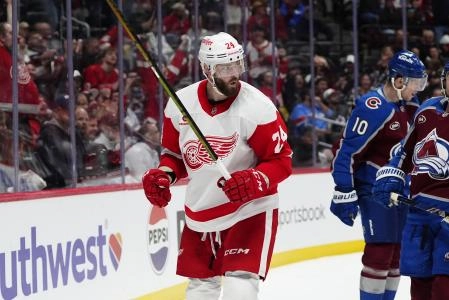 Mar 25, 2025; Denver, Colorado, USA; Detroit Red Wings left wing Austin Watson (24) celebrates his goal in the third period against the Colorado Avalanche at Ball Arena. Mandatory Credit: Ron Chenoy-Imagn Images