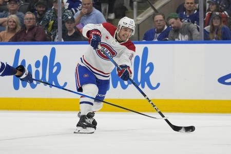 Sep 27, 2025; Toronto, Ontario, CAN; Montreal Canadiens defenseman Marc Del Gaizo (37) shoots the puck against the Toronto Maple Leafs during the second period at Scotiabank Arena. Mandatory Credit: John E. Sokolowski-Imagn Images