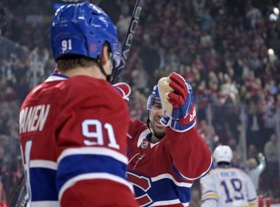 Oct 20, 2025; Montreal, Quebec, CAN; Montreal Canadiens forward Oliver Kapanen (91) celebrates with teammate forward Alex Newhook (15) after scoring a goal against the Buffalo Sabres during the first period at the Bell Centre. Mandatory Credit: Eric Bolte-Imagn Images