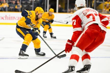 Oct 19, 2024; Nashville, Tennessee, USA; Nashville Predators center Ryan O'Reilly (90) skates with the puck against the Detroit Red Wings during the first period at Bridgestone Arena.