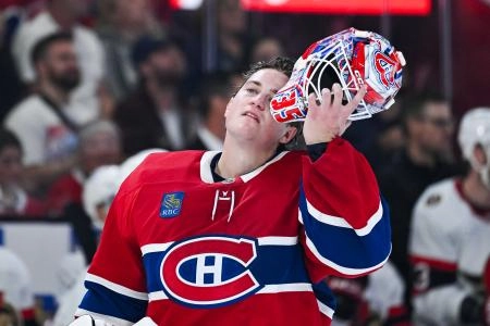 Oct 4, 2025; Montreal, Quebec, CAN; Montreal Canadiens goalie Samuel Montembeault (35) looks on as he pulls on his helmet against the Ottawa Senators during the second period at Bell Centre.