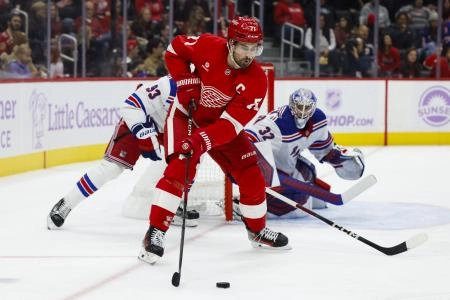 Nov 9, 2024; Detroit, Michigan, USA; Detroit Red Wings center Dylan Larkin (71) skates with the puck against the New York Rangers in the second period at Little Caesars Arena. Nov 9, 2024; Detroit, Michigan, USA; Detroit Red Wings center Dylan Larkin (71) skates with the puck against the New York Rangers in the second period at Little Caesars Arena.