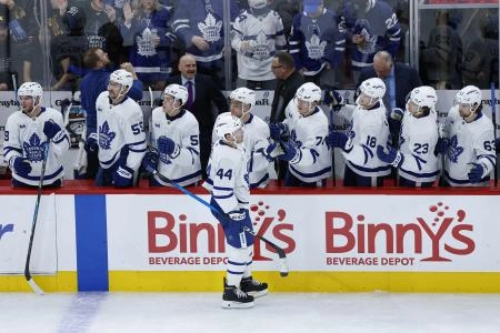 Nov 15, 2025; Chicago, Illinois, USA; Toronto Maple Leafs defenseman Morgan Rielly (44) celebrates with teammates after scoring against the Chicago Blackhawks during the second period at United Center. Mandatory Credit: Kamil Krzaczynski-Imagn Images
