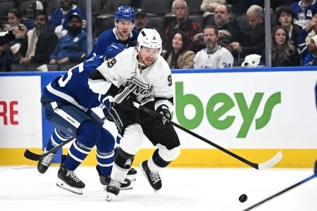 Los Angeles Kings forward Adrian Kempe (9) skates with the puck against the Toronto Maple Leafs