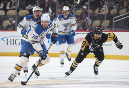 Oct 27, 2025; Pittsburgh, Pennsylvania, USA; St. Louis Blues center Oskar Sundqvist (70) moves the puck against the Pittsburgh Penguins during the second period at PPG Paints Arena. Mandatory Credit: Charles LeClaire-Imagn Images