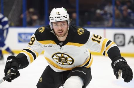 Jan 9, 2025; Tampa, Florida, USA; Boston Bruins center John Beecher (19) skates against the Tampa Bay Lightning during the second period at Amalie Arena. Mandatory Credit: Kim Klement Neitzel-Imagn Images