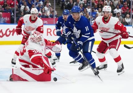 Oct 2, 2025; Toronto, Ontario, CAN; Toronto Maple Leafs center Max Domi (11) battles for the puck in front of Detroit Red Wings goaltender Cam Talbot (39) during the first period at Scotiabank Arena. Oct 2, 2025; Toronto, Ontario, CAN; Toronto Maple Leafs center Max Domi (11) battles for the puck in front of Detroit Red Wings goaltender Cam Talbot (39) during the first period at Scotiabank Arena.