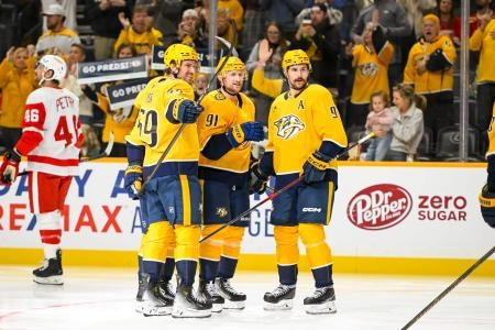 Oct 19, 2024; Nashville, Tennessee, USA; Nashville Predators center Steven Stamkos (91) celebrates his goal with his teammates against the Detroit Red Wings during the third period at Bridgestone Arena.