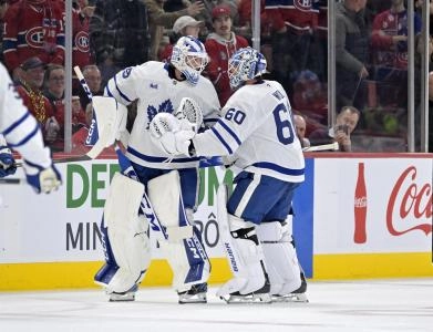 Toronto Maple Leafs goaltender Dennis Hildeby entering the game in relief for Joseph Woll.