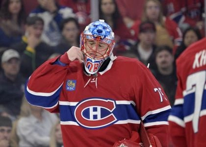 Nov 22, 2025; Montreal, Quebec, CAN; Montreal Canadiens goalie Jakub Dobes (75) adjusts his mask during the third period of the game against the Toronto Maple Leafs at the Bell Centre. Mandatory Credit: Eric Bolte-Imagn Images