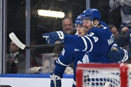 Oct 14, 2025; Toronto, Ontario, CAN; Toronto Maple Leafs forward Auston Matthews (34) celebrates with forward Matthews Knies (23) after scoring a goal against the Nashville Predators in the third period at Scotiabank Arena. Mandatory Credit: Dan Hamilton-Imagn Images