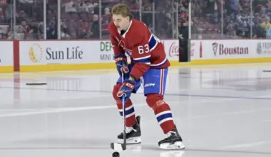 Georges Laraque offers advice and a warning to Florian Xhekaj before the game in Utah