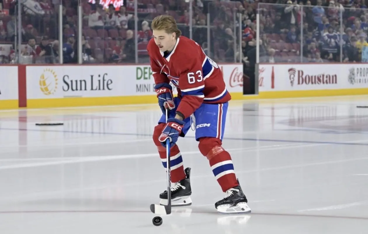 Georges Laraque offers advice and a warning to Florian Xhekaj before the game in Utah