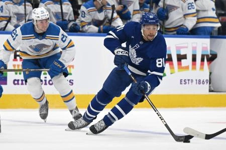 Toronto Maple Leafs forward Dakota Joshua carrying the puck against the St. Louis Blues.