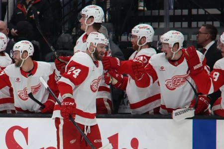 Mar 24, 2025; Salt Lake City, Utah, USA; Detroit Red Wings left wing Austin Watson (24) celebrates a goal against the Utah Hockey Club during the third period at Delta Center.