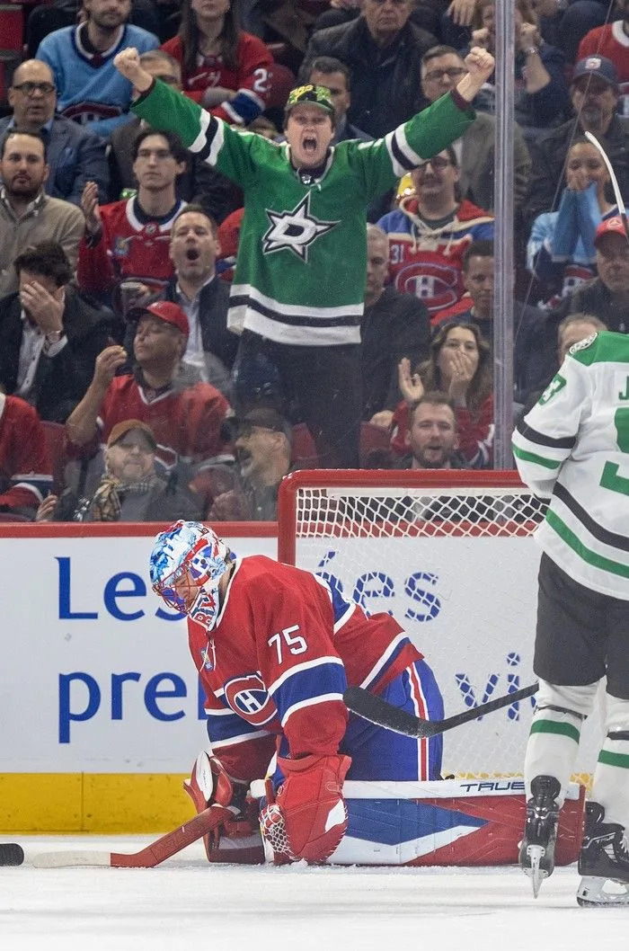  Dallas Stars fan celebrates as Canadiens’ Jakub Dobes hangs his head after a goal by Wyatt Johnston during first period in Montreal on Thursday.