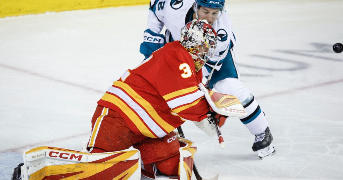 Wolf makes 16 saves for his 1st shutout of the season in Flames' 2-0 win over Sharks | Sports