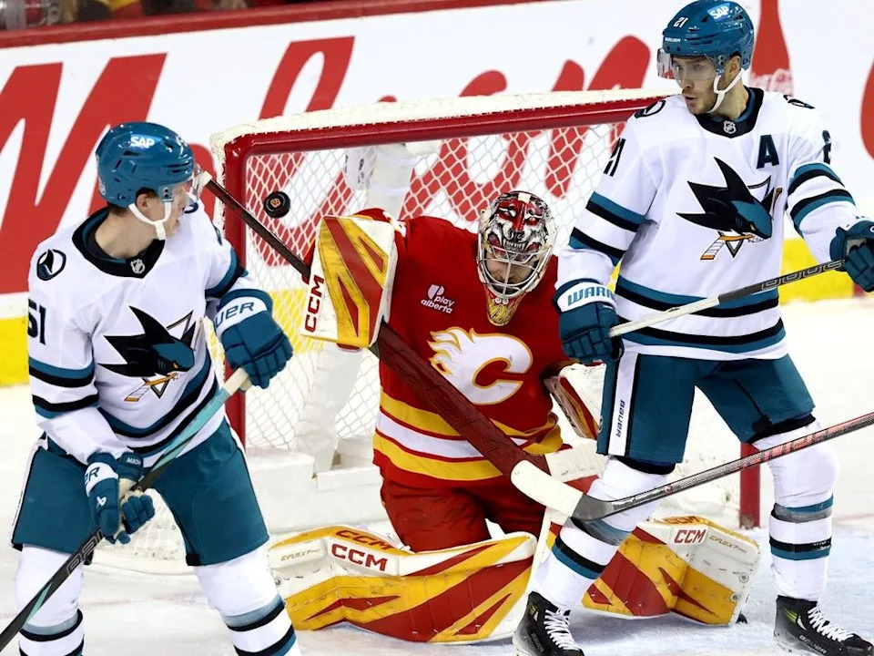  Flames goalie Dustin Wolf defends against the Sharks during Thursday’s game.
