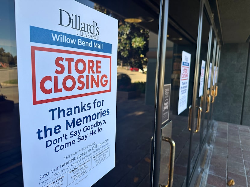 Signs on the exterior of the Dillard's department store at The Shops at Willow Bend read...