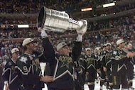 File photo: The Stars' Brett Hull celebrates with the Stanley Cup after the third OT of Game...