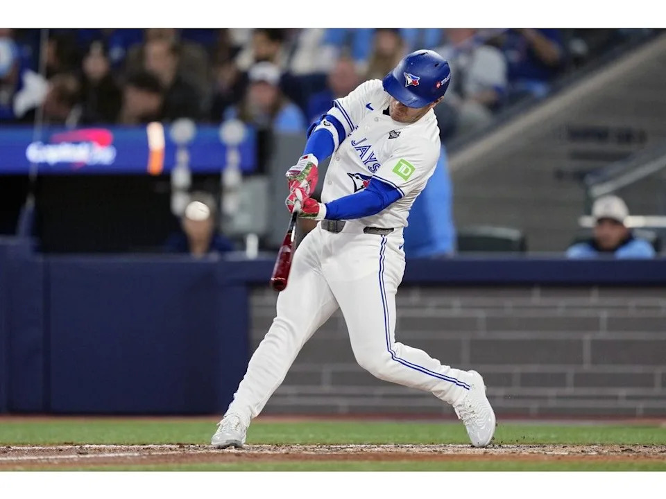 Daulton Varsho of the Toronto Blue Jays hits a two-run home run against the Los Angeles Dodgers during the fourth inning in game one of the 2025 World Series at Rogers Centre on October 24, 2025 in Toronto, Ontario.